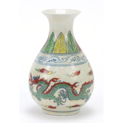 469 - Chinese porcelain vase decorated in the wucai palette with two dragons amongst clouds, six figure ch... 