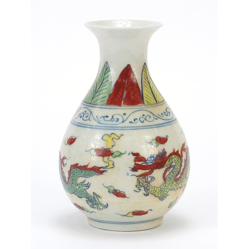 469 - Chinese porcelain vase decorated in the wucai palette with two dragons amongst clouds, six figure ch... 