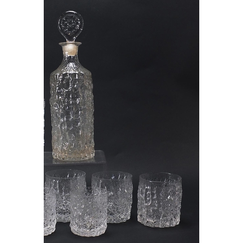 54 - Geoffrey Baxter for Whitefriars, textured glassware comprising two decanters, set of six tumbles and... 