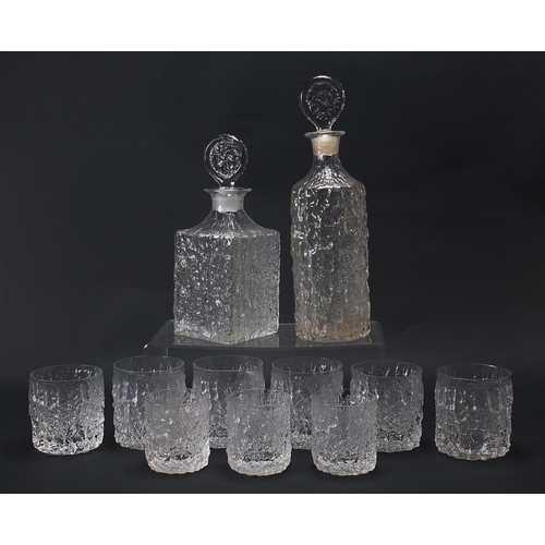 54 - Geoffrey Baxter for Whitefriars, textured glassware comprising two decanters, set of six tumbles and... 