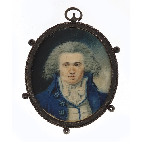 25 - Georgian oval hand painted portrait miniature of a gentleman housed in a steel mourning pendant, the... 