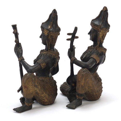 399 - Pair of Thai partially gilt bronze figures of musicians, each 15cm high