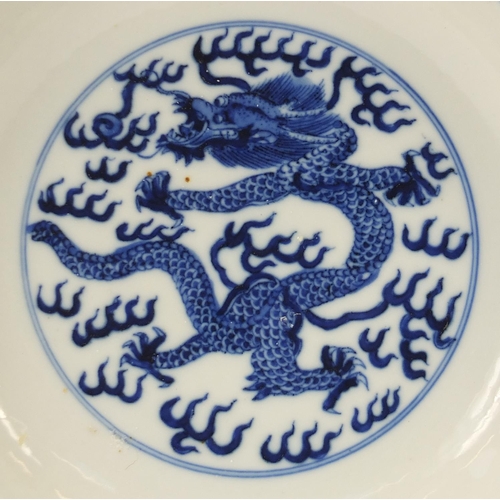 826 - Chinese blue and white porcelain shallow dish hand painted with dragons chasing a flaming pearl amon... 