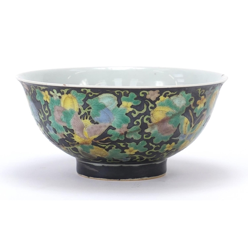 277 - Chinese porcelain footed bowl hand painted in the famille noir palette with butterflies amongst flow... 