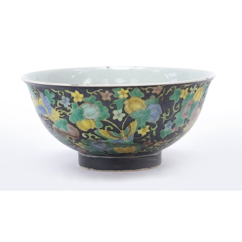 277 - Chinese porcelain footed bowl hand painted in the famille noir palette with butterflies amongst flow... 