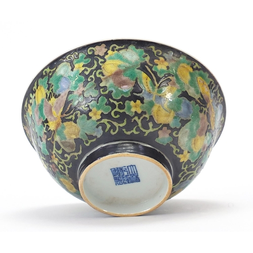 277 - Chinese porcelain footed bowl hand painted in the famille noir palette with butterflies amongst flow... 