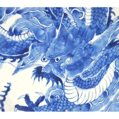 182 - Chinese blue and white porcelain plate hand painted with a dragon amongst clouds chasing a flaming p... 