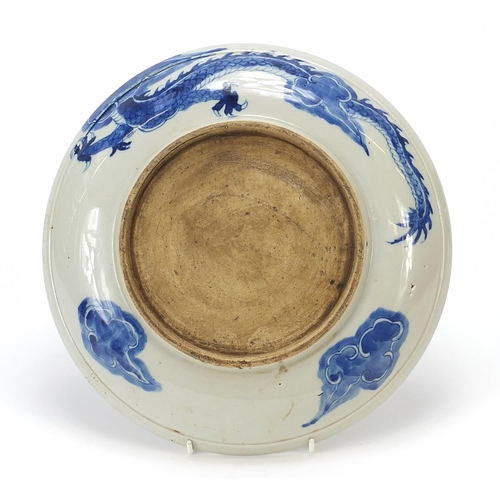 182 - Chinese blue and white porcelain plate hand painted with a dragon amongst clouds chasing a flaming p... 