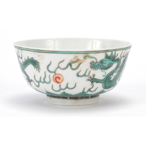 824 - Chinese porcelain bowl hand painted in green and iron red with two dragons chasing a flaming pearl a... 