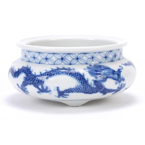 820 - Chinese blue and white porcelain tripod censer hand painted with two dragons chasing a flaming pearl... 