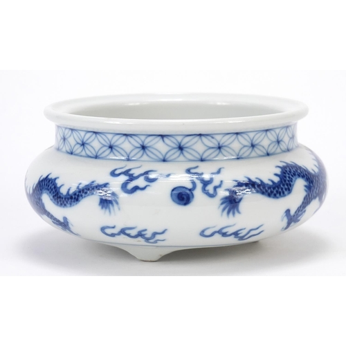 820 - Chinese blue and white porcelain tripod censer hand painted with two dragons chasing a flaming pearl... 