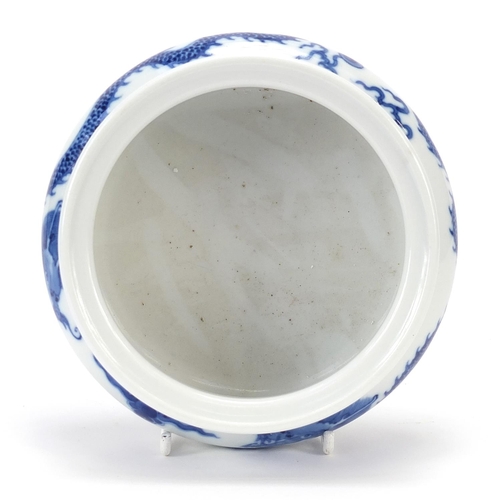 820 - Chinese blue and white porcelain tripod censer hand painted with two dragons chasing a flaming pearl... 