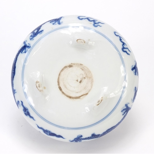 820 - Chinese blue and white porcelain tripod censer hand painted with two dragons chasing a flaming pearl... 