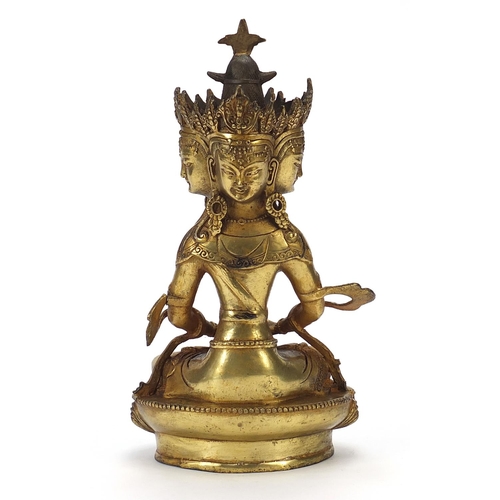 839 - Chino Tibetan gilt bronze figure of four headed Buddha, 31cm high