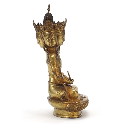 839 - Chino Tibetan gilt bronze figure of four headed Buddha, 31cm high