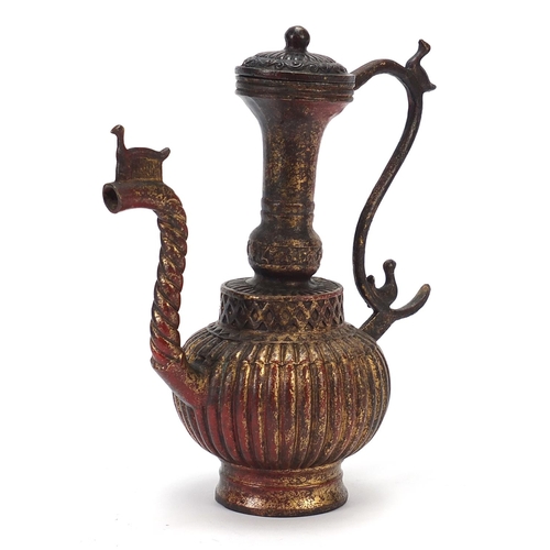 229 - Islamic gilt bronze lidded water jug, 24cm high