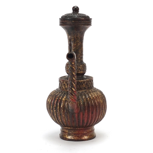 229 - Islamic gilt bronze lidded water jug, 24cm high