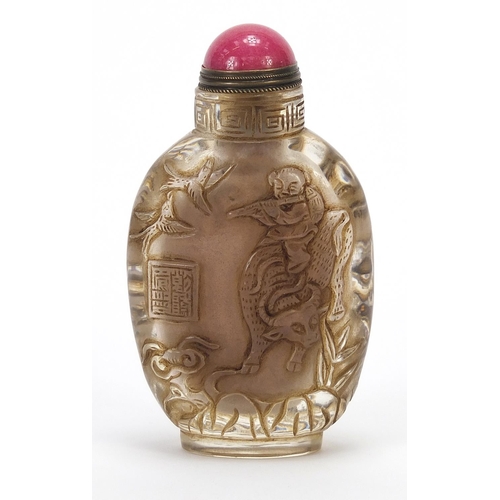 289 - Chinese rock crystal snuff bottle with hardstone stopper carved with figures and birds, 9.5cm high