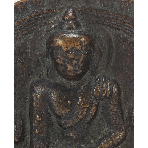 401 - Three Nepalese patinated bronze plaques of Buddha with display stands, the largest 11cm high