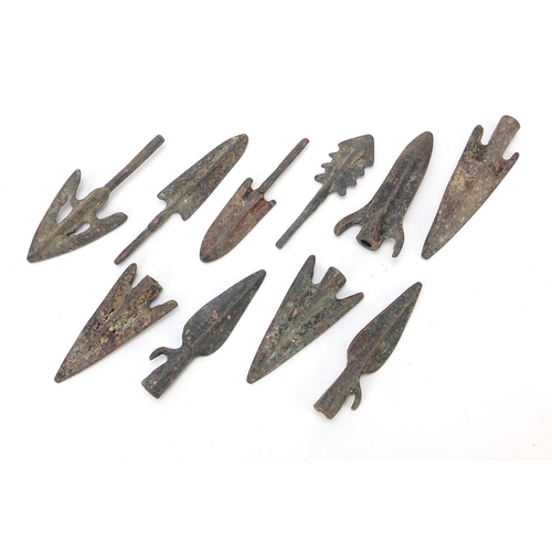 408 - Ten patinated bronze arrow heads, the largest approximately 8cm in length