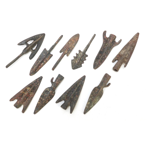 408 - Ten patinated bronze arrow heads, the largest approximately 8cm in length