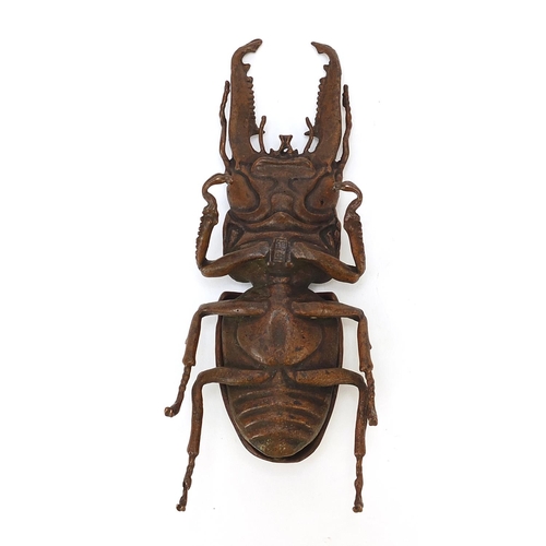 292 - Large Japanese patinated bronze beetle with articulated back, impressed marks to the underside, 13.5... 