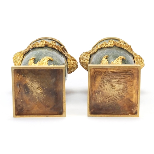 606 - Pair of French gilt bronze and marble pedestal vases and covers with faun head handles, each 32cm hi... 