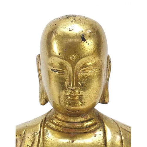 568 - Chino Tibetan gilt bronze figure of a monk, 27cm high