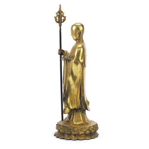 568 - Chino Tibetan gilt bronze figure of a monk, 27cm high