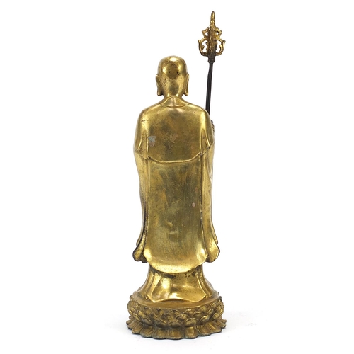 568 - Chino Tibetan gilt bronze figure of a monk, 27cm high