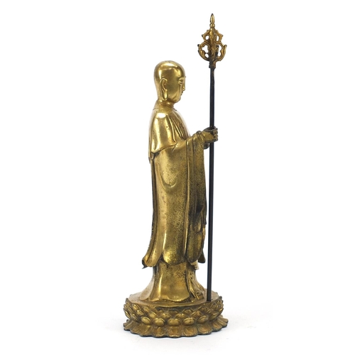 568 - Chino Tibetan gilt bronze figure of a monk, 27cm high