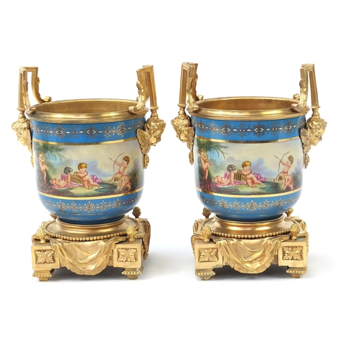 861 - Pair of French gilt bronze mounted porcelain pots in the style of Sevres decorated with classical fi... 