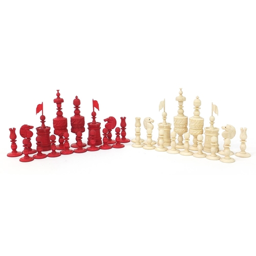 136 - Good large 19th century half stained carved ivory chess set, the largest pieces each 14cm high