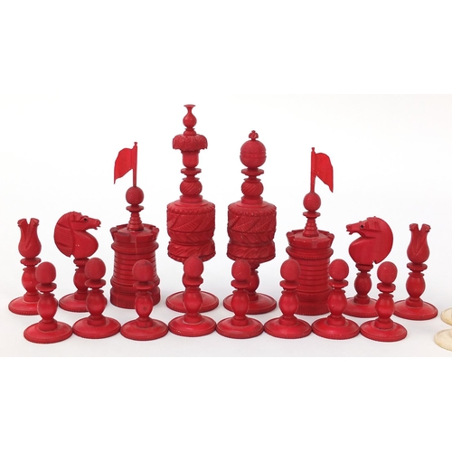 136 - Good large 19th century half stained carved ivory chess set, the largest pieces each 14cm high