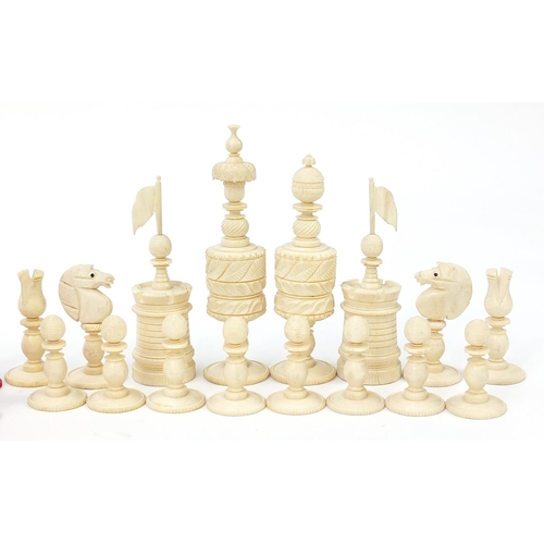 136 - Good large 19th century half stained carved ivory chess set, the largest pieces each 14cm high