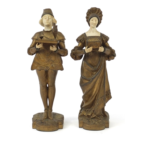 42 - Pair of gilt metal and alabaster figures of a boy and girl in dutch dress, the largest 28.5cm high