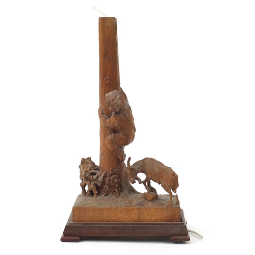 586 - German prisoner of war carved wood lampstand in the form of a goat beside a boy climbing a tree trun... 