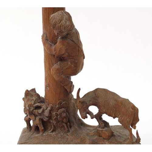 586 - German prisoner of war carved wood lampstand in the form of a goat beside a boy climbing a tree trun... 