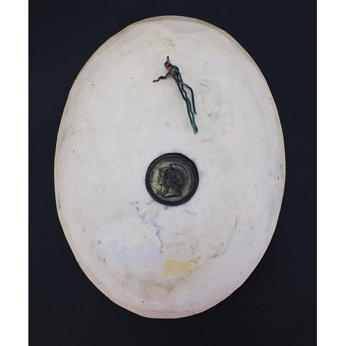 1040 - White marble style oval plaque decorated in relief with Christ falling from the cross, inset plaque ... 