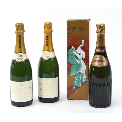 1088 - Three bottles of Champagne comprising two Justerini & Brooks Sarcey and Heidsieck & Co with box