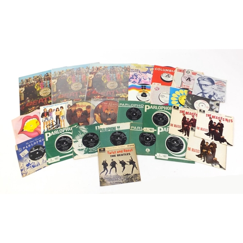 2618 - Vinyl LP's and 45rpm records including Sargent Pepper's Lonely Hearts Club Band, David Bowie and The... 