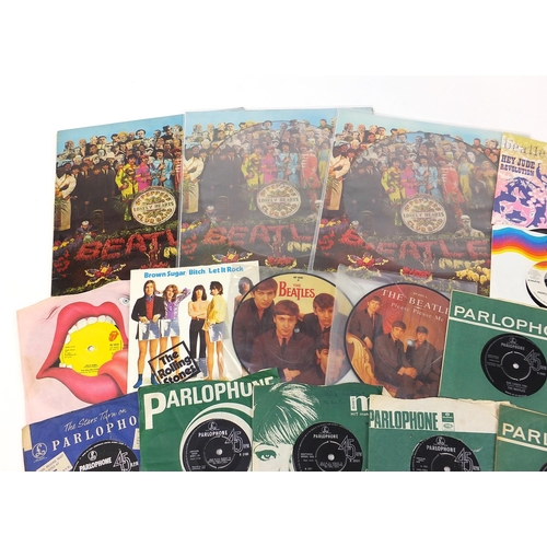 2618 - Vinyl LP's and 45rpm records including Sargent Pepper's Lonely Hearts Club Band, David Bowie and The... 