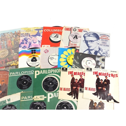 2618 - Vinyl LP's and 45rpm records including Sargent Pepper's Lonely Hearts Club Band, David Bowie and The... 