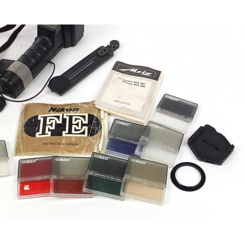 686 - Nikon FE camera, lenses and accessories including filters