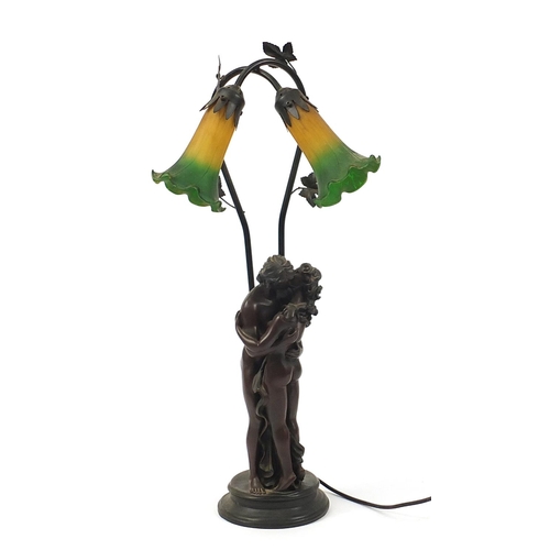 1048 - Bronzed nude lovers table lamp with glass shades, 66cm high