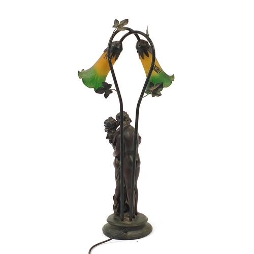 1048 - Bronzed nude lovers table lamp with glass shades, 66cm high