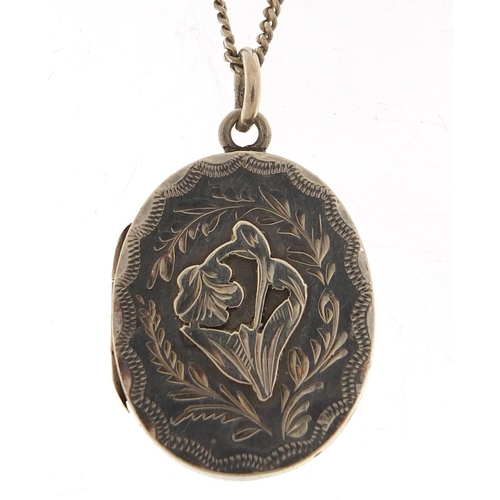 888 - Edwardian oval silver locket on a silver necklace, the locket Birmingham 1904, 2.8cm high and 60cm i... 