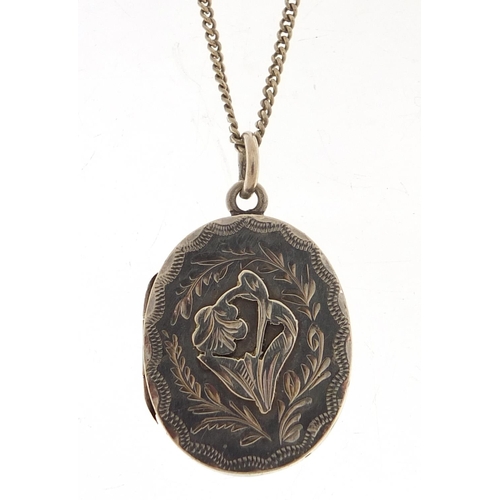 888 - Edwardian oval silver locket on a silver necklace, the locket Birmingham 1904, 2.8cm high and 60cm i... 