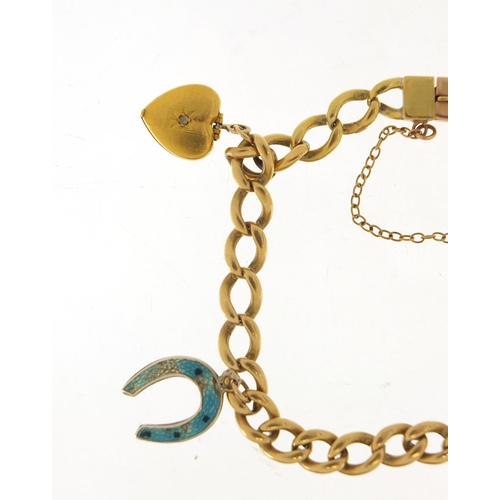 60 - Unmarked gold bracelet with gold and silver charms, the bracelet tests as 18ct gold, total 23.0g