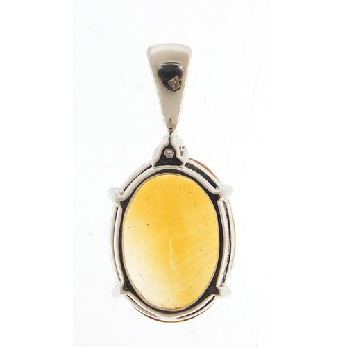 172 - 9ct white gold mandarin citrine and white topaz pendant, 2.5cm high, 4.6g